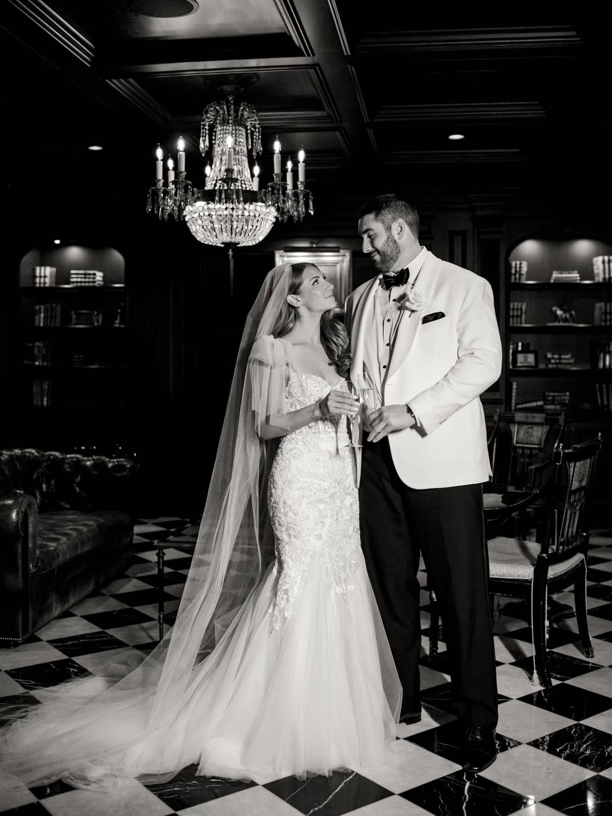 Jack Driscoll in a white dinner jacket with his bride, in black and white
